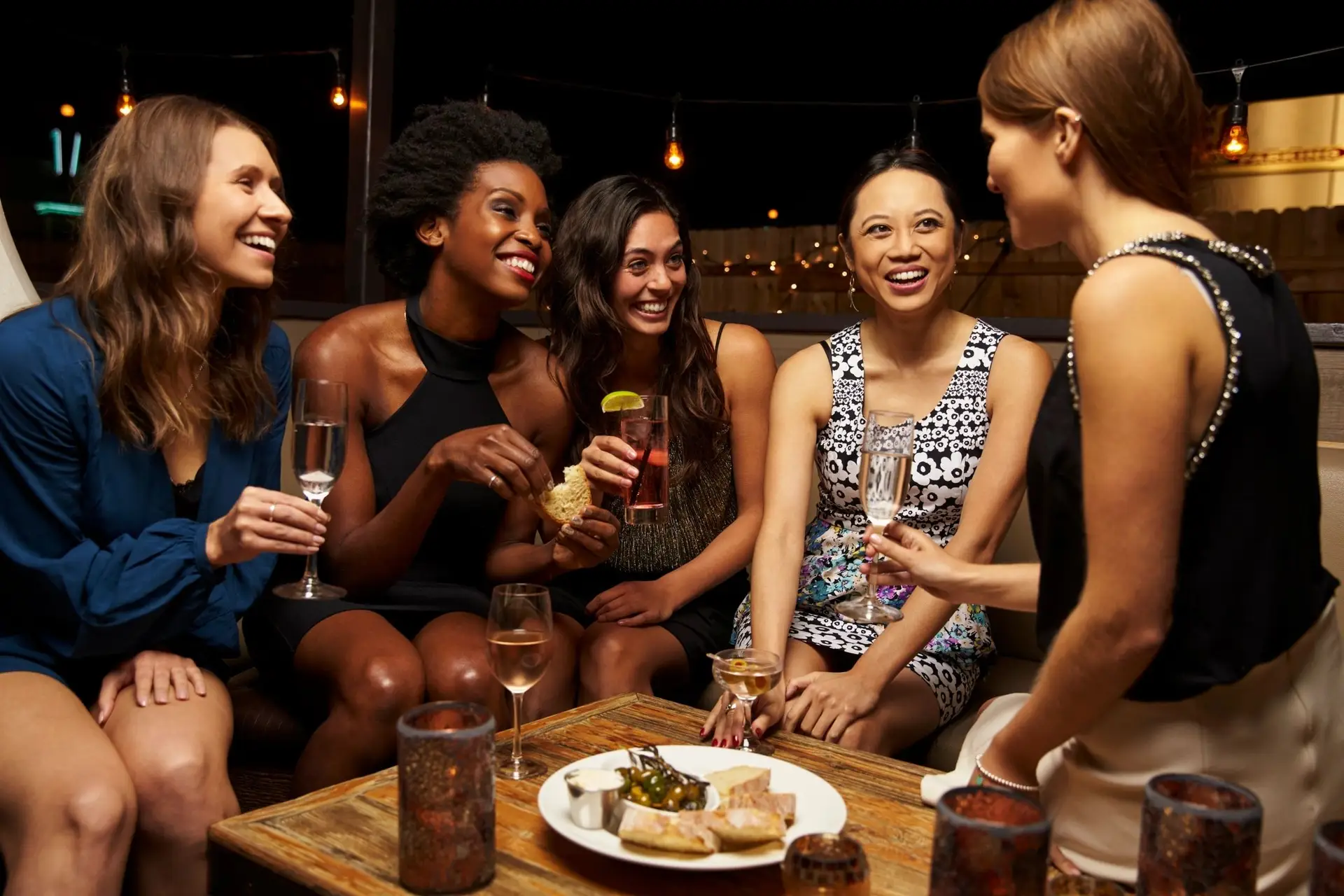 Ladies enjoying cocktails and appetizers