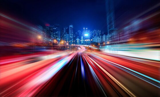 Time-lapse photo of traffic in a city at night.