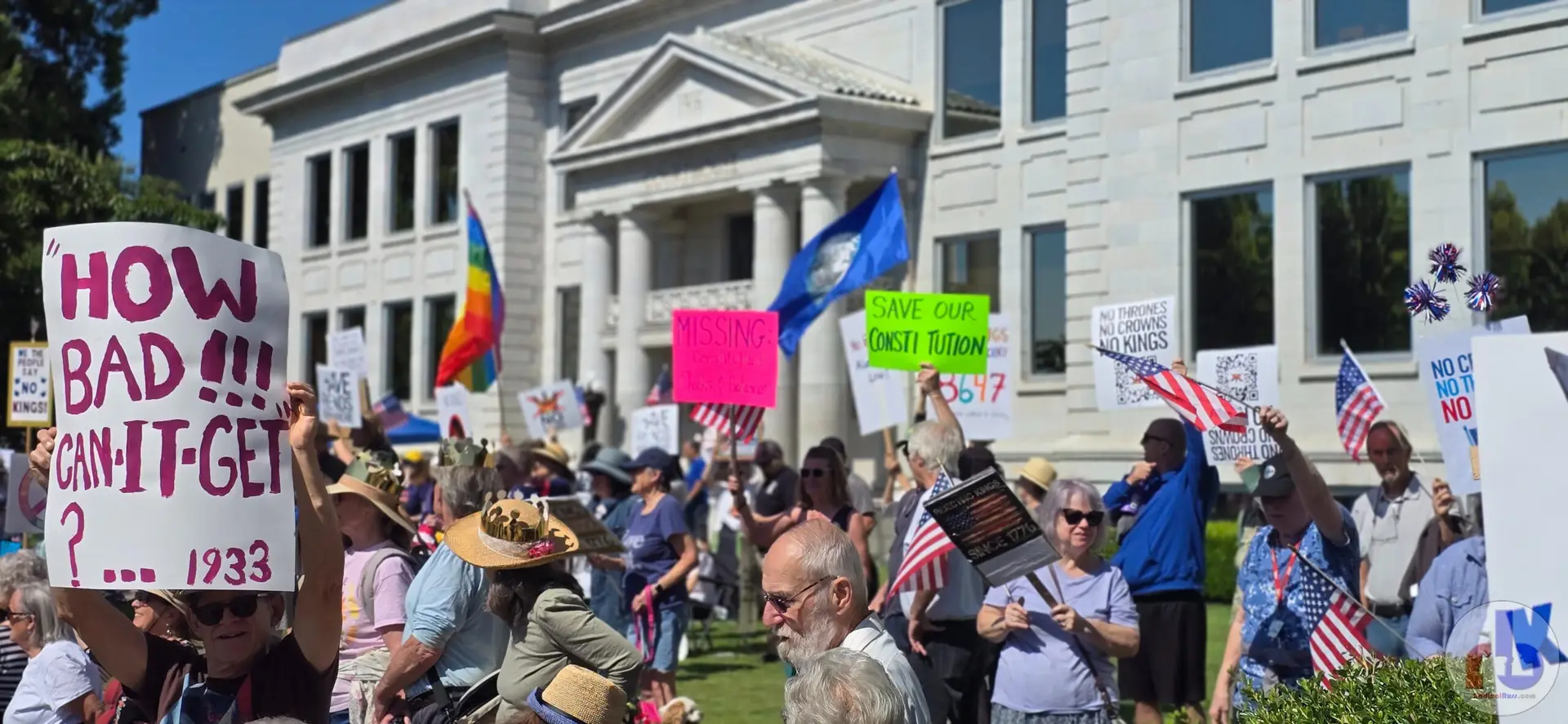 Wide shot of the courthouse full of protestors, with "How Bad Can It Get... 1933" in the foreground.