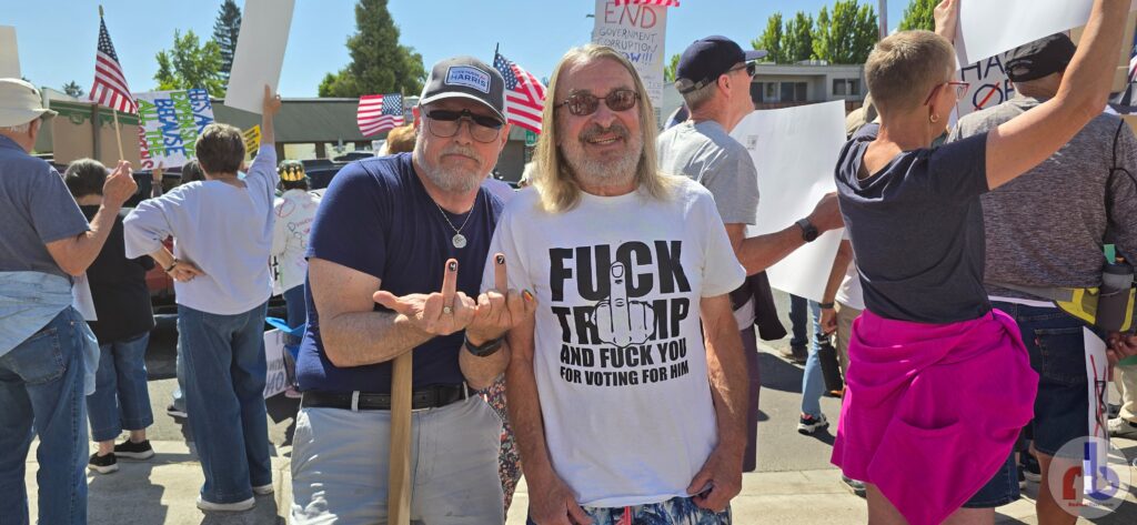 Russ with the guy in Fuck Trump and Fuck You For Voting For Him t-shirt